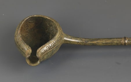 A LONG HANDLE BRONZE SPOON