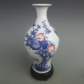 BLUE AND WHITE UNDERGLAZE RED LONGEVITY AND FORTUNE OLIVE-SHAPED PORCELAIN VASE