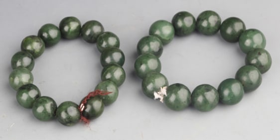 GROUP OF TWO FINE GREEN JADE BRACELETS