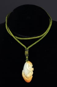 A MELON; SHAPED HETIAN JADE PENDANT,  ZI LIAO