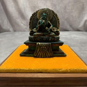 A FINE TURQUOISE STONE MADE TIBETAN STATUE