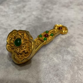 A SMALL BRONZE MADE RUYI