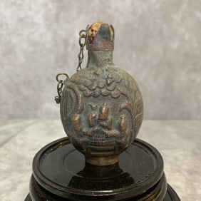 A FINELY CARVED WHITE BRONZE SNUFF BOTTLE