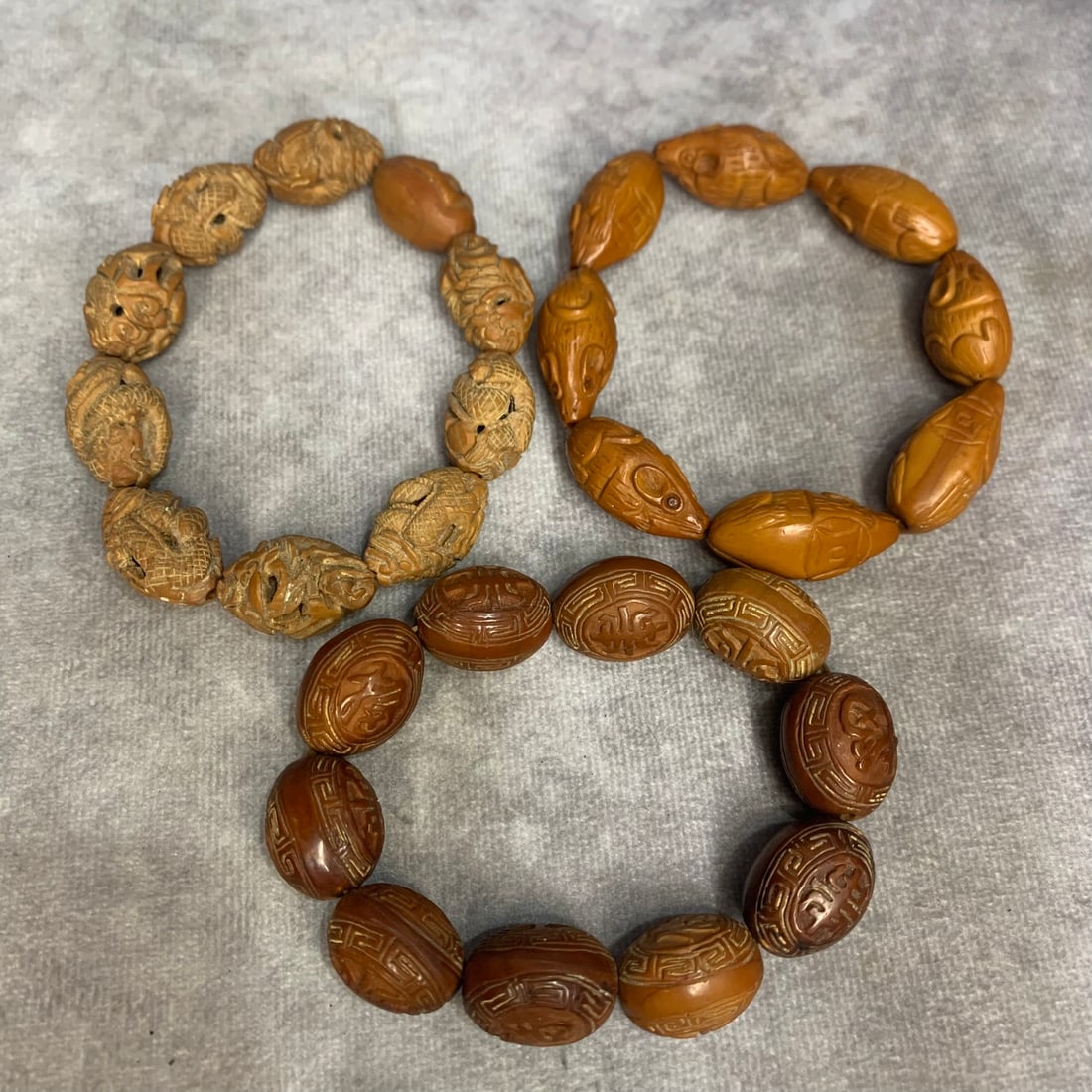 GROUP OF THREE OLIVE SEED BRACELETS (1 of 7)