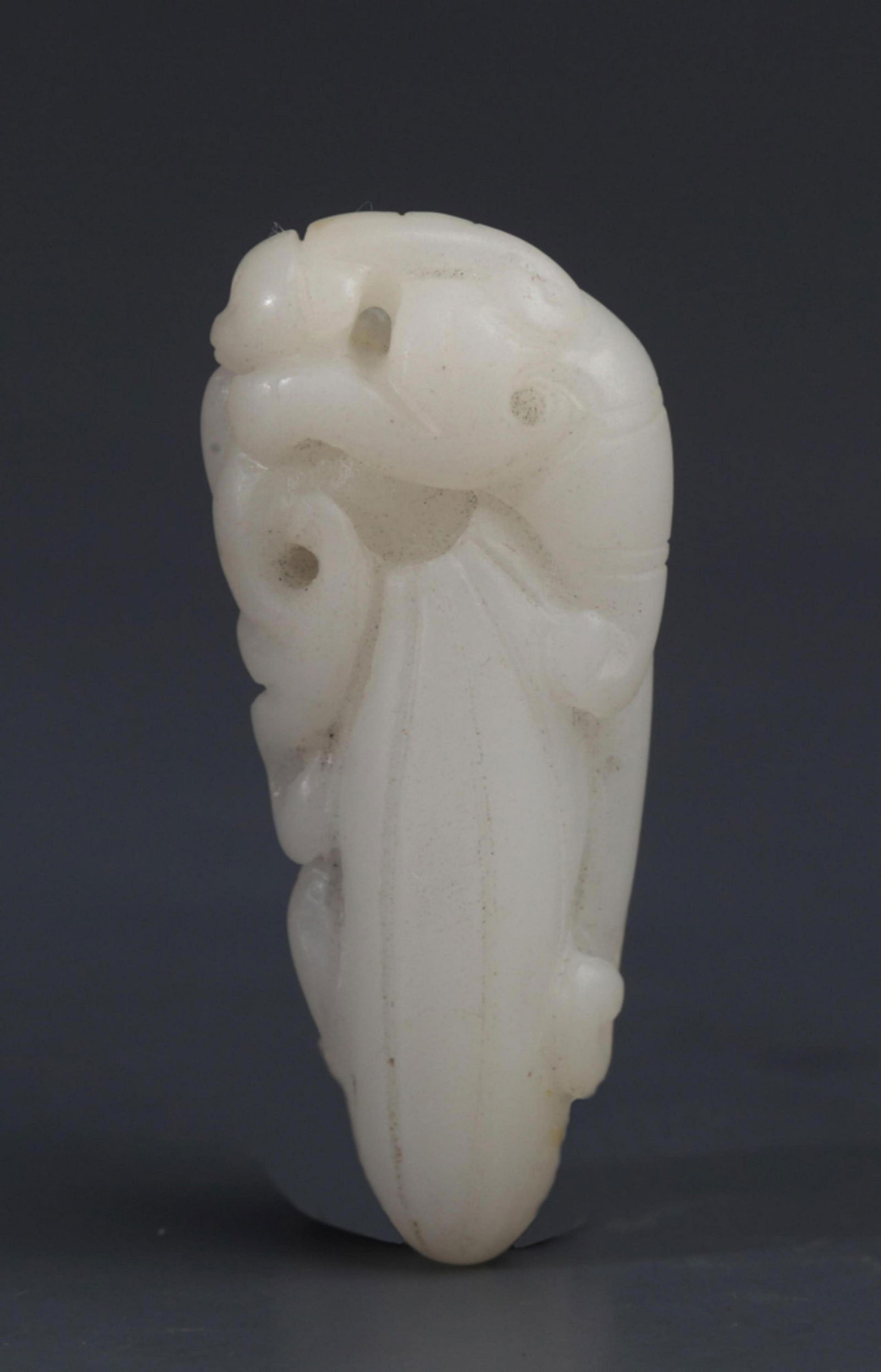 A WHITE JADE MELON SHAPED PENDANT (1 of 3)