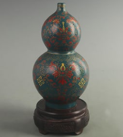 A DARK BLUE FINELY PAINTED CALABASH SHAPED PORCELAIN BOTTLE