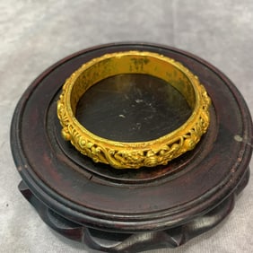 A FINELY MADE GILT BRONZE BANGLE