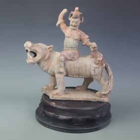 PAINTED POTTERY FIGURE WITH CENTRAL ASIAN FIGURE AND AUSPICIOUS BEAST MOTIF