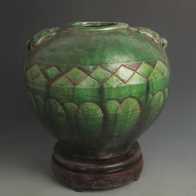 GREEN-GLAZED JAR WITH GEOMETRIC PATTERNS AND ANIMAL EARS