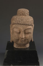 STONE-CARVED BUDDHA HEAD