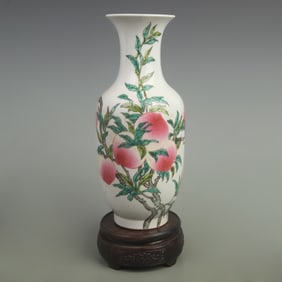 A FINE FAMILLE ROSE NINE PEACHES WINTER MELON PORCELAIN VASE