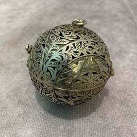 A FINE WHITE BRONZE BALL SHAPED INCENSE BURNER