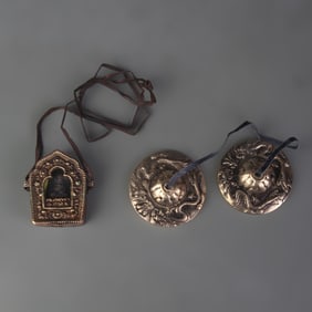 GROUP OF TIBETAN BUDDHIST INSTRUMENTS PENDANT