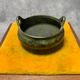 A FINE BRONZE THREE FOOT INCENSE BURNER WITH EAR HANDLES