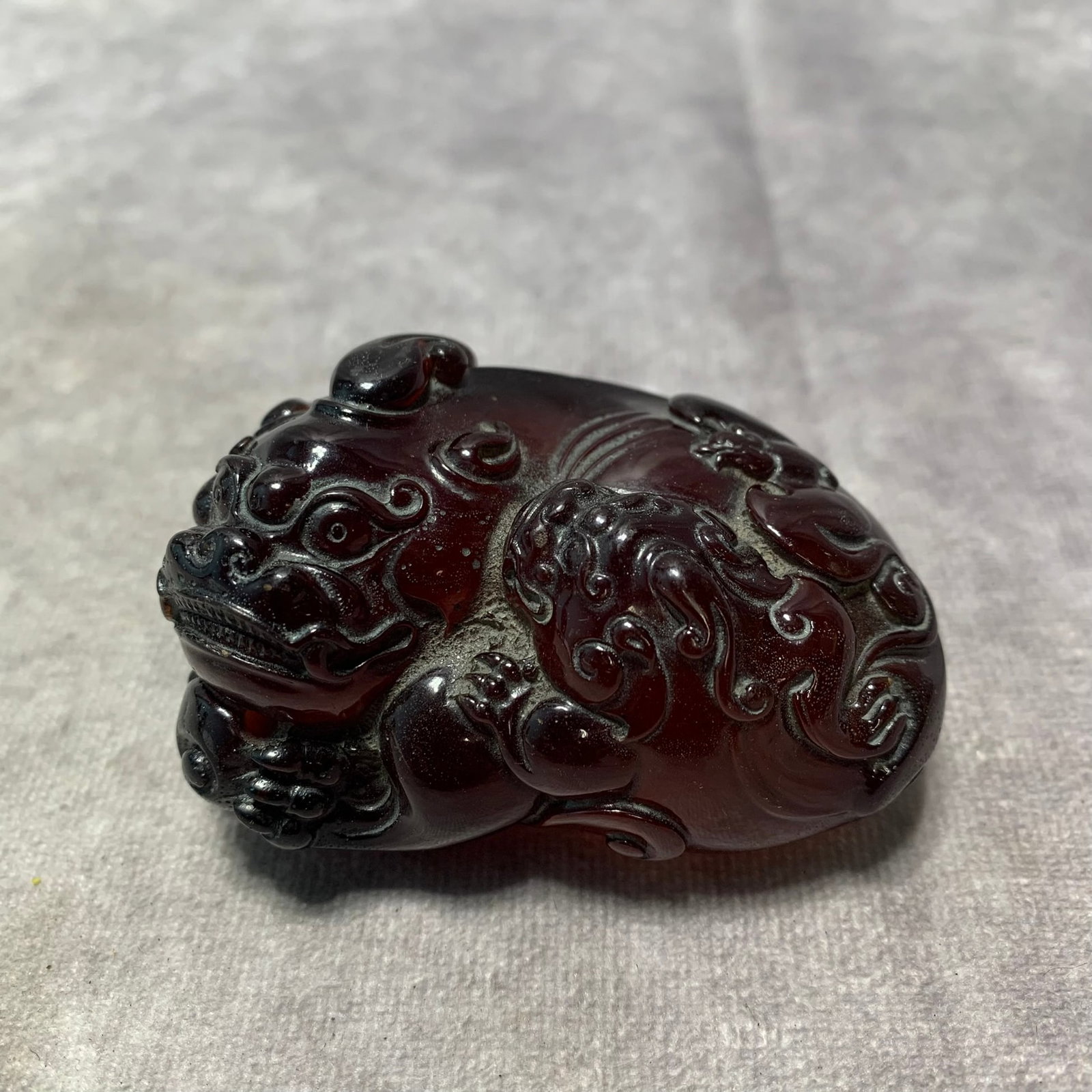 AMBER MADE LUCKY LION ORNAMENT: Republic Period; Long: 2.8 inch; Width: 1.9 inch; High: 1.6 inch;