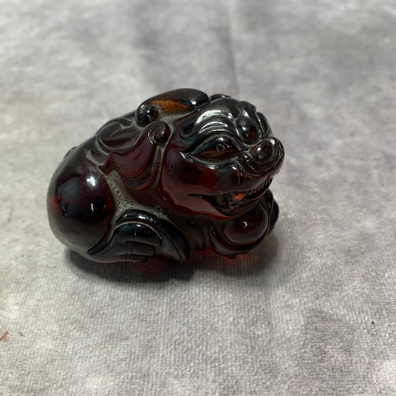 AMBER MADE LUCKY LION ORNAMENT: Republic Period; Long: 3 inch; Width: 1.8 inch; High: 3 inch;