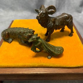 GROUP OF THREE BRONZE ORNAMENTS