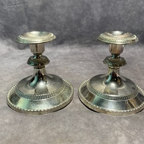 PAIR OF BRONZE-SILVER PLATED CANDLE HOLDERS