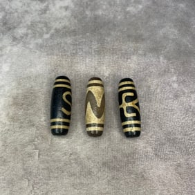 GROUP OF THREE SMALL TIBETIAN TIAN ZHU PENDANT