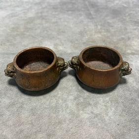PAIR OF QING DYNASTY XUAN CHARACTER BRONZE LION-EAR INCENSE BURNERS