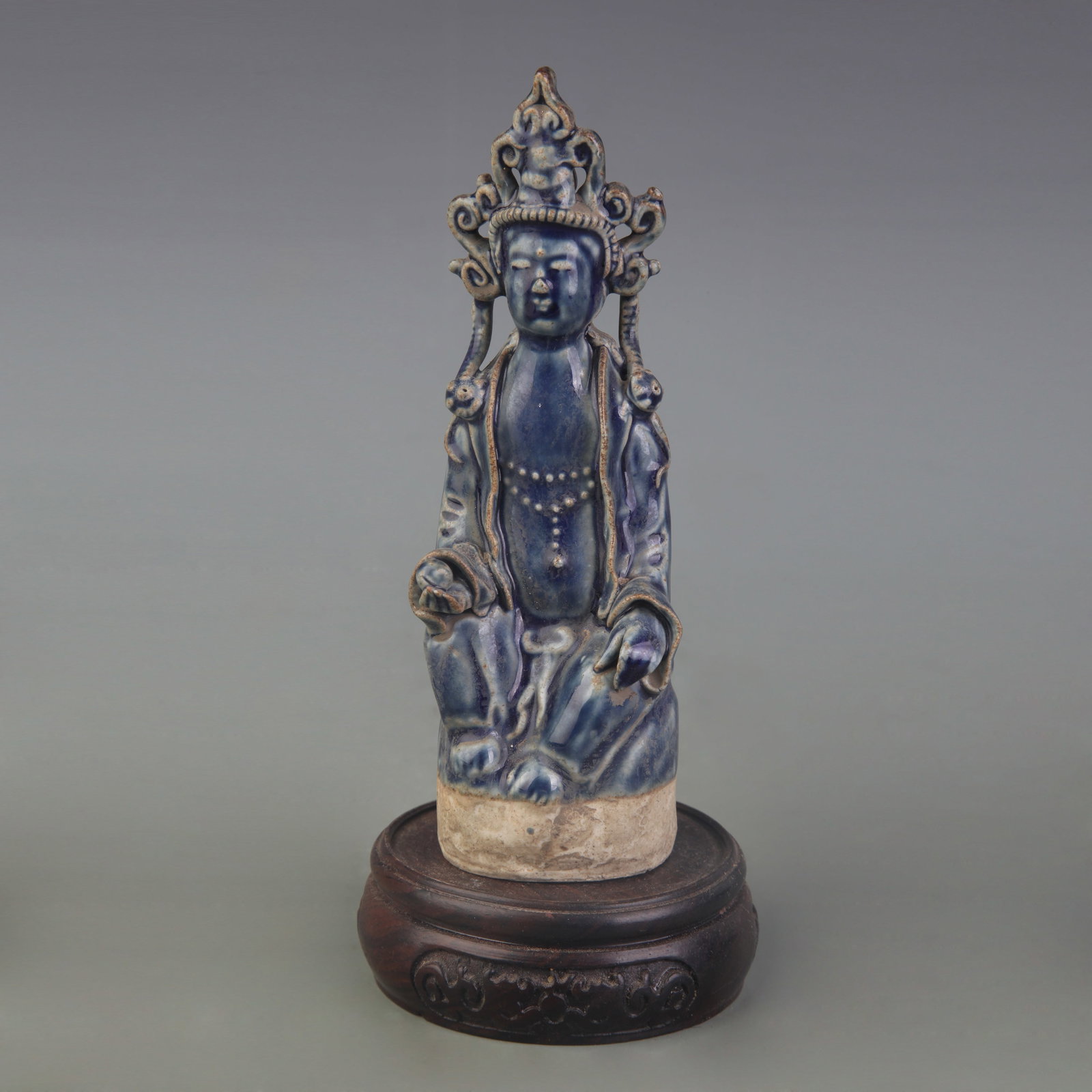 A FINE PORCELAIN BLUE-GLAZED GUANYIN STATUE: Qing Dynasty; High: 5.8 inch