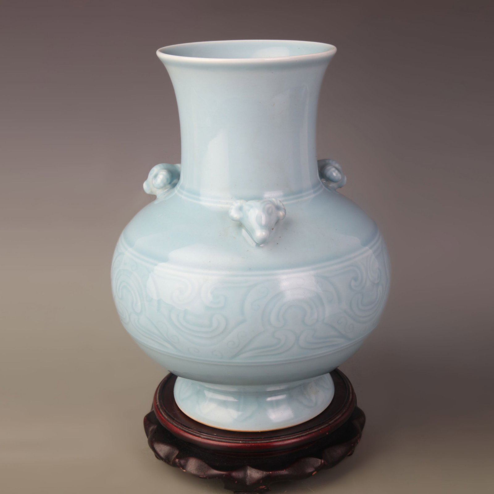 CELADON KILN THREE-SHEEP-HEAD PORCELAIN VASE: Qing Dynasty Qian Long Period; Diameter: 5.0 inch; High: 10.5 inch
