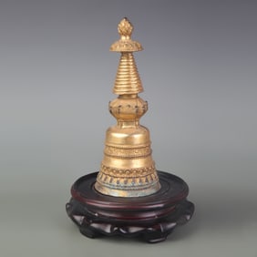 A FINE BRONZE GILDED BRONZE RELIC PAGODA