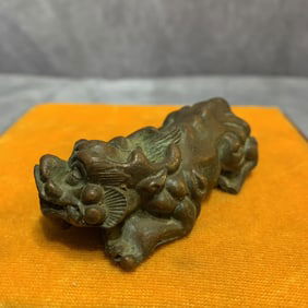 A SMALL BRONZE RUI SHOU FIGURE