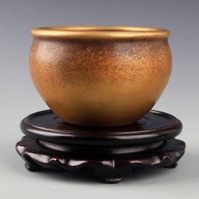 A SMALL AND ROUND BRONZE INCENSE BURNER