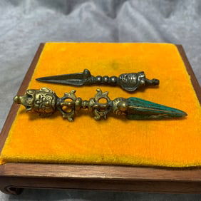 PAIR OF TIBETAN BRONZE RITUAL IMPLEMENTS