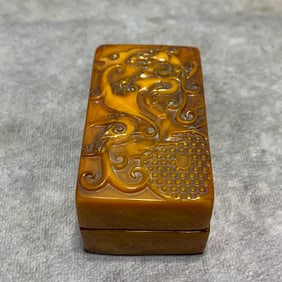 A FINE CELLULOID MADE SEAL AND BOX