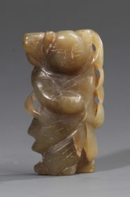 A FINE YELLOW JADE IN FIGURE OF BOY WITH LOTUS