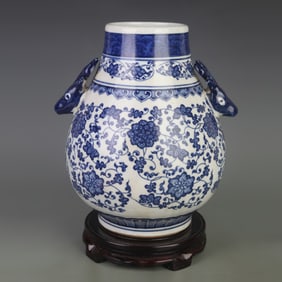BLUE AND WHITE FLORAL VASE WITH DEER HEAD HANDLES