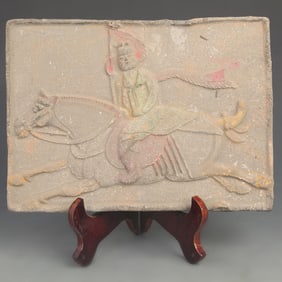 A FINE TANG DYNASTY STYLE HUMAN ON HORSE PATTERN POTTERY BRICK