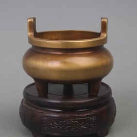 A FINE BRONZE VERTICAL EAR THREE-LEGGED CENSER