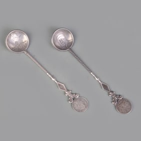 PAIR OF COIN STYLE SILVER PLATED SPOONS