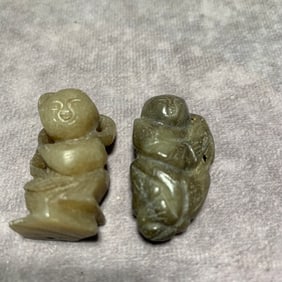 MING DYNASTY HETIAN GREENISH-WHITE JADE FIGURE PENDANTS (2 PIECES)