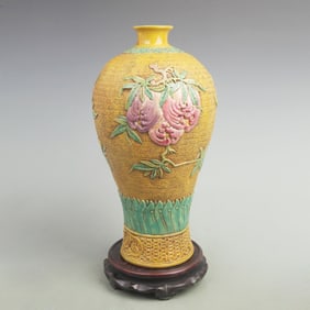 A YELLOW GOUND PEACH AND POMEGRANATE PATTERN VASE