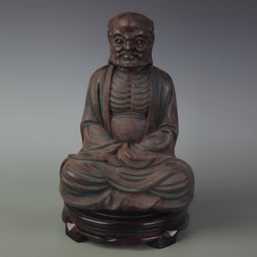 A FINE SANDALWOOD MADE BUDDHA STATUE