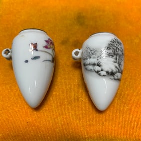 PAIR OF FAMILLE ROSE PORCELAIN BIRD FEEDERS