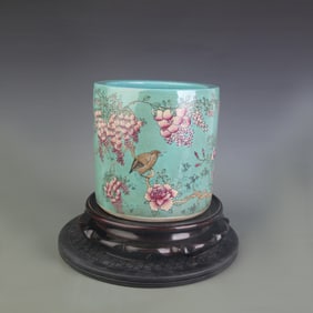 FAMILLE ROSE GREEN GROUND BIRD-AND-FLOWER PORCELAIN BRUSH POT
