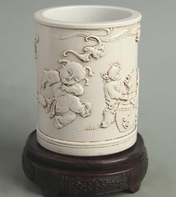 WANG BINGRONG'S CARVED CHILD BLESSING PATTERN PORCELAIN PEN HOLDER