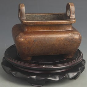 BRONZE INCENSE BURNER WITH FIGURAL SCENES AND TWIN EARS