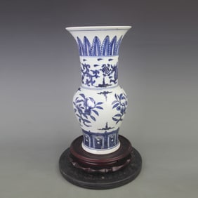 BLUE AND WHITE PORCELAIN VASE WITH FLORAL AND BIRD MOTIFS