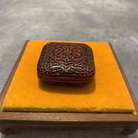 A FINE SMALL RED CARVED LACQUER BOX