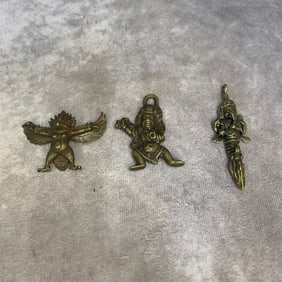 GROUP OF THREE SMALL TIBETAN PENDANT