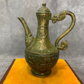 A FINELY CARVED BRONZE EWER