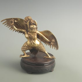 A FINELY MADE BRONZE GARU?A STATUE