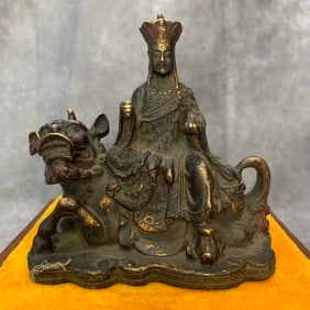 A FINE BRONZE GUAN YIN RIDING TIGER STATUE
