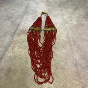 A FINE SMALL RED GLASS NECKLACE